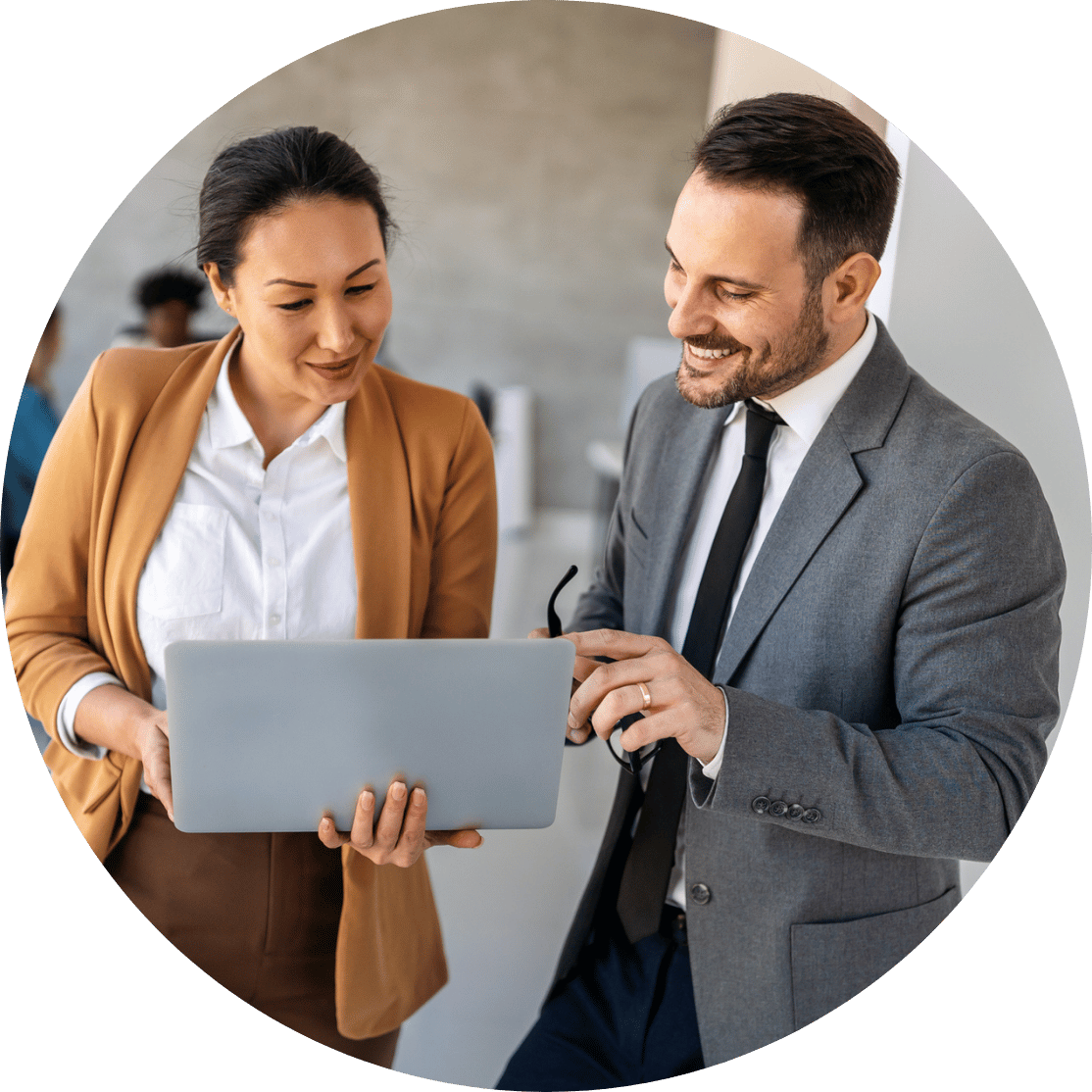 Man and woman looking at a laptop