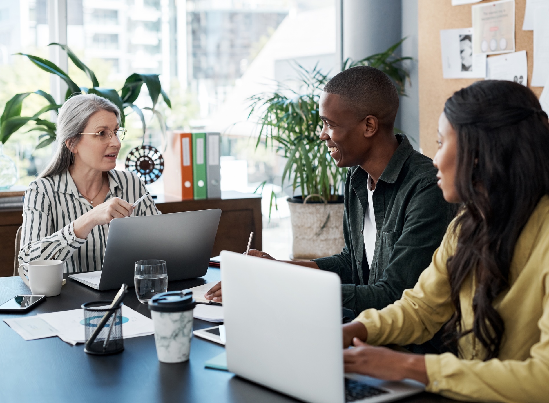 Three professionals in a meeting