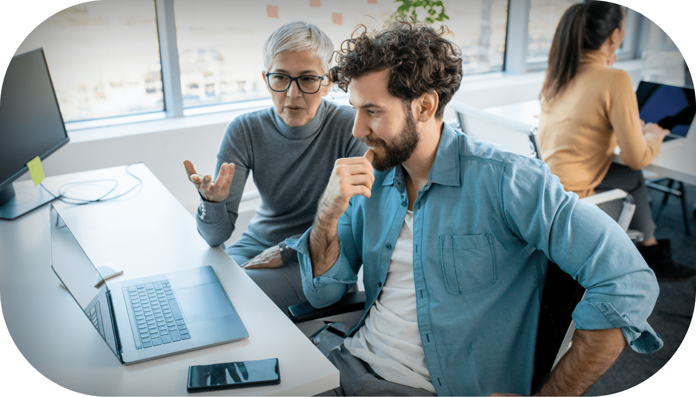 Two people working on a computer