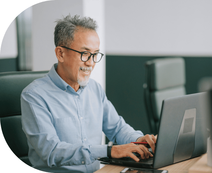A man typing on a desktop