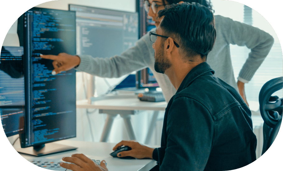 Two coworkers around a computer