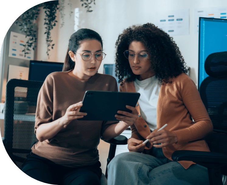 Two coworkers discussing around a tablet