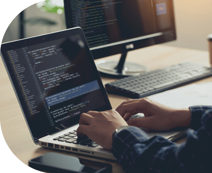 Person coding on a laptop