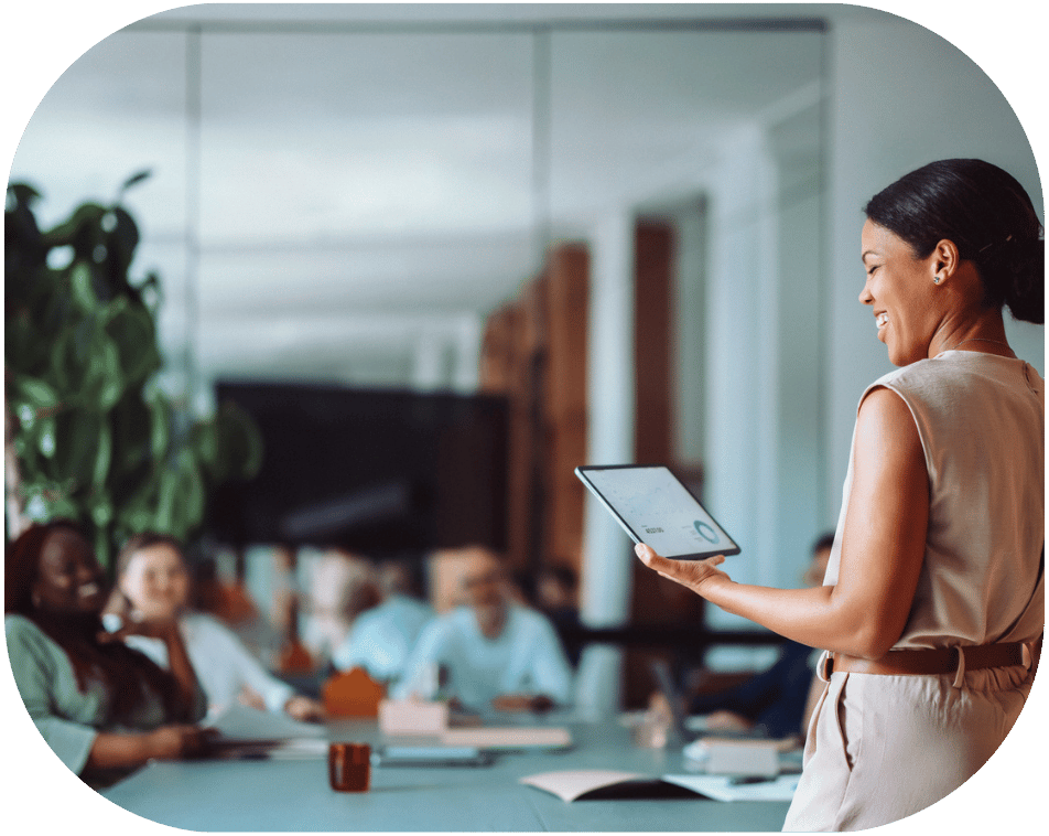 A woman presenting to coworkers