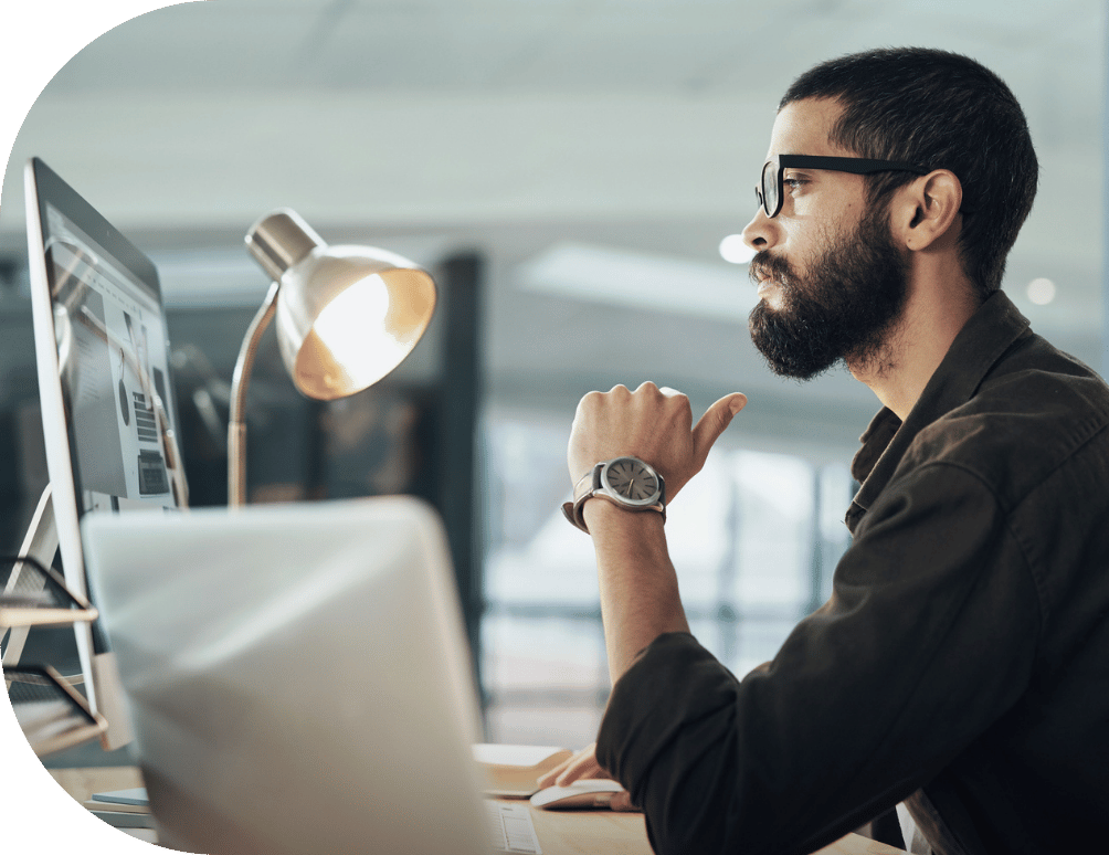 A man looking at a computer