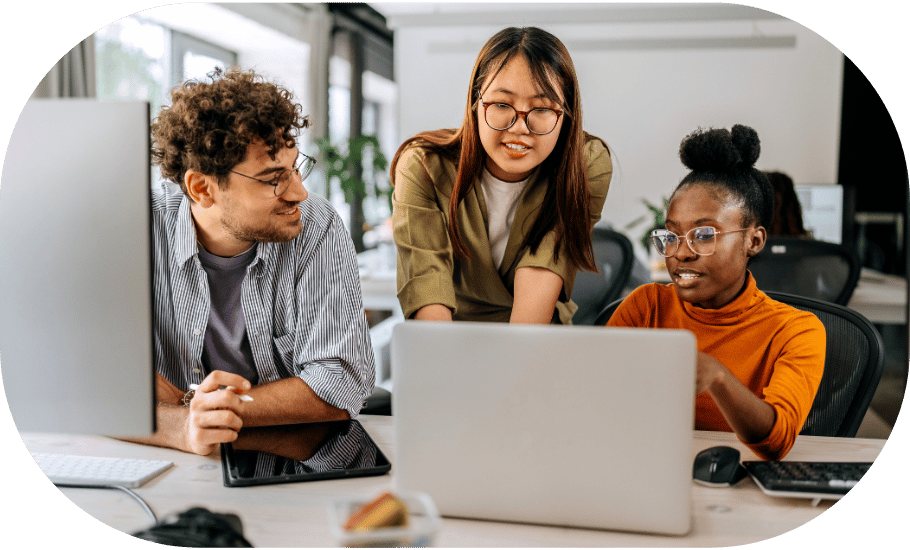 Three coworkers discussing around a laptop