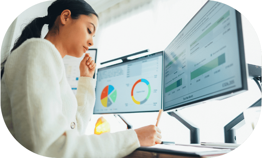 A woman looking at an analytics dashboard