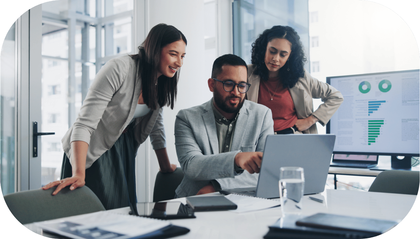 Three coworkers discussing an analytics dashboard