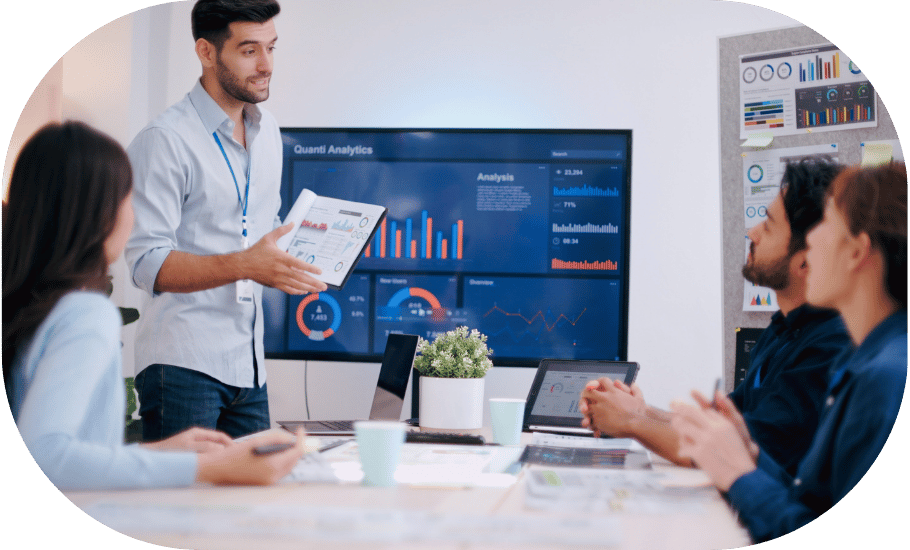 A man presenting with analytics dashboard on the screen