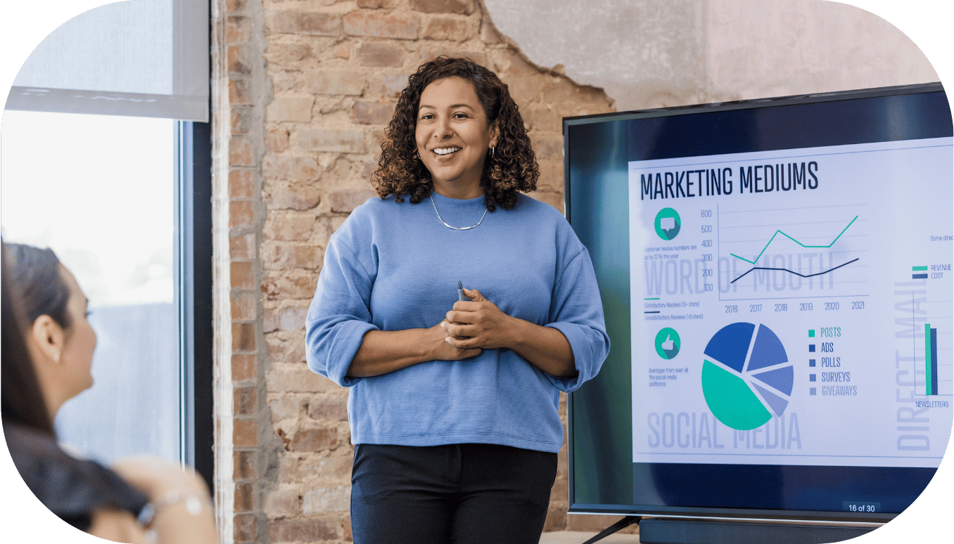 A woman presenting on marketing mediums