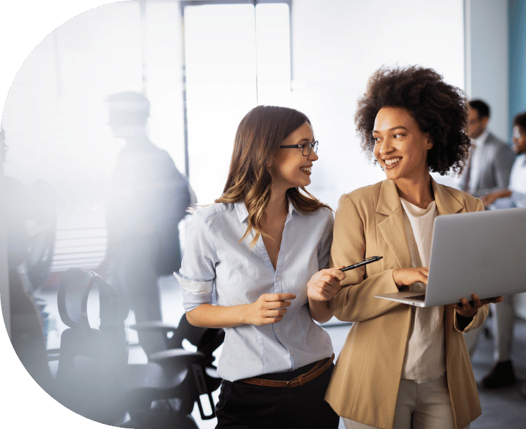 Two professional women walking and talking