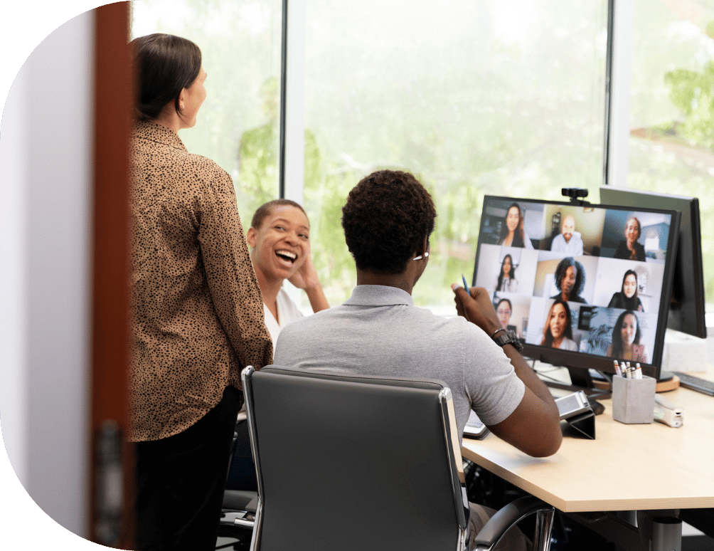 Three coworkers chatting in a virtual meeting