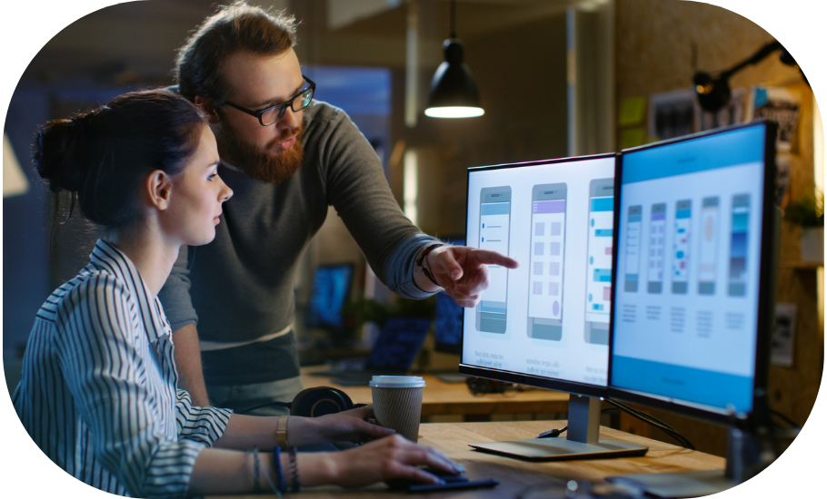 Two people viewing a desktop