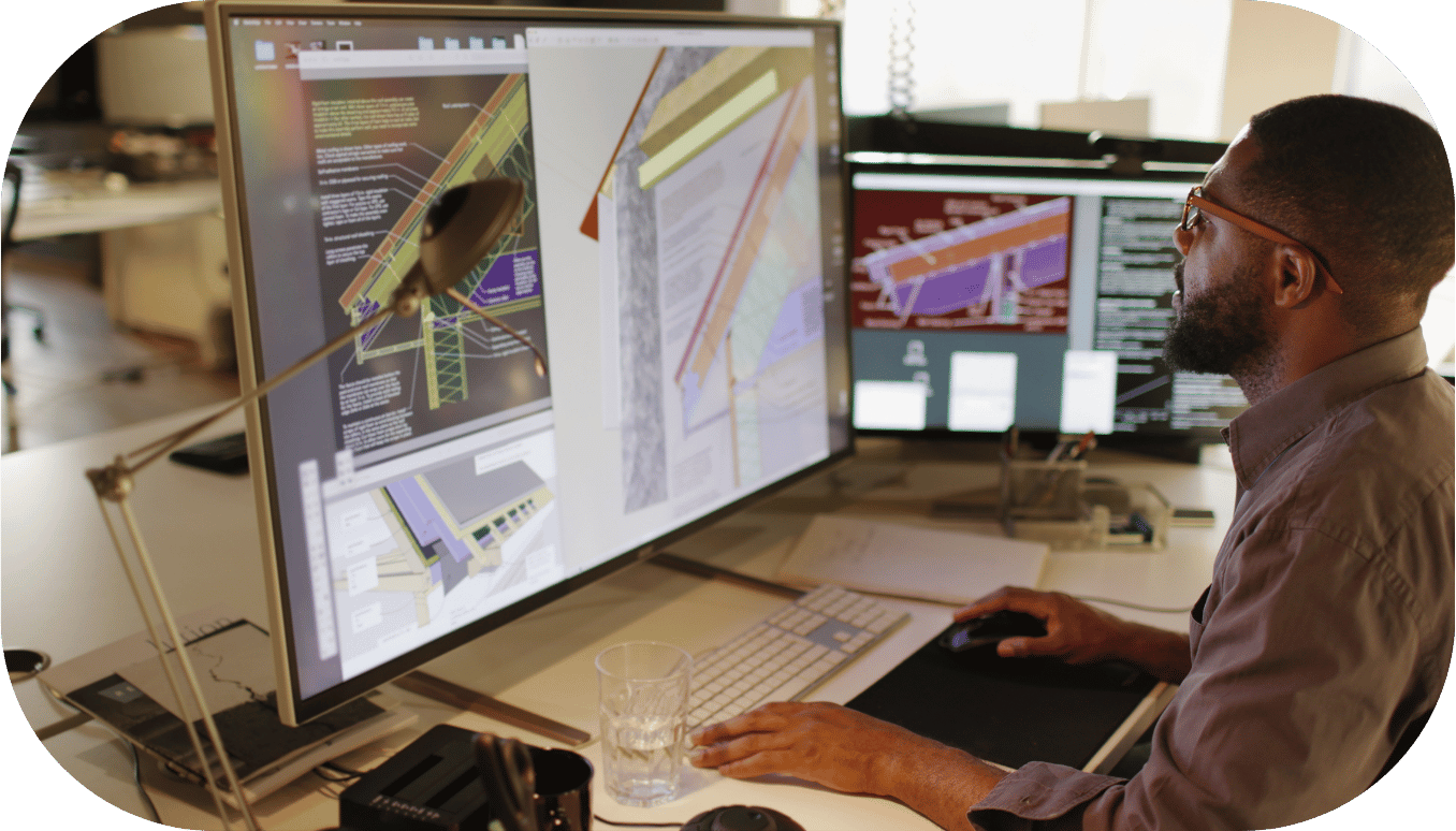 A man viewing design assets on a computer
