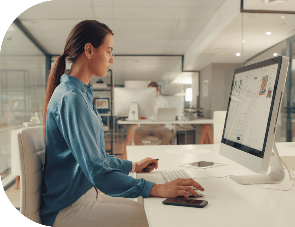 A woman on a computer in an office